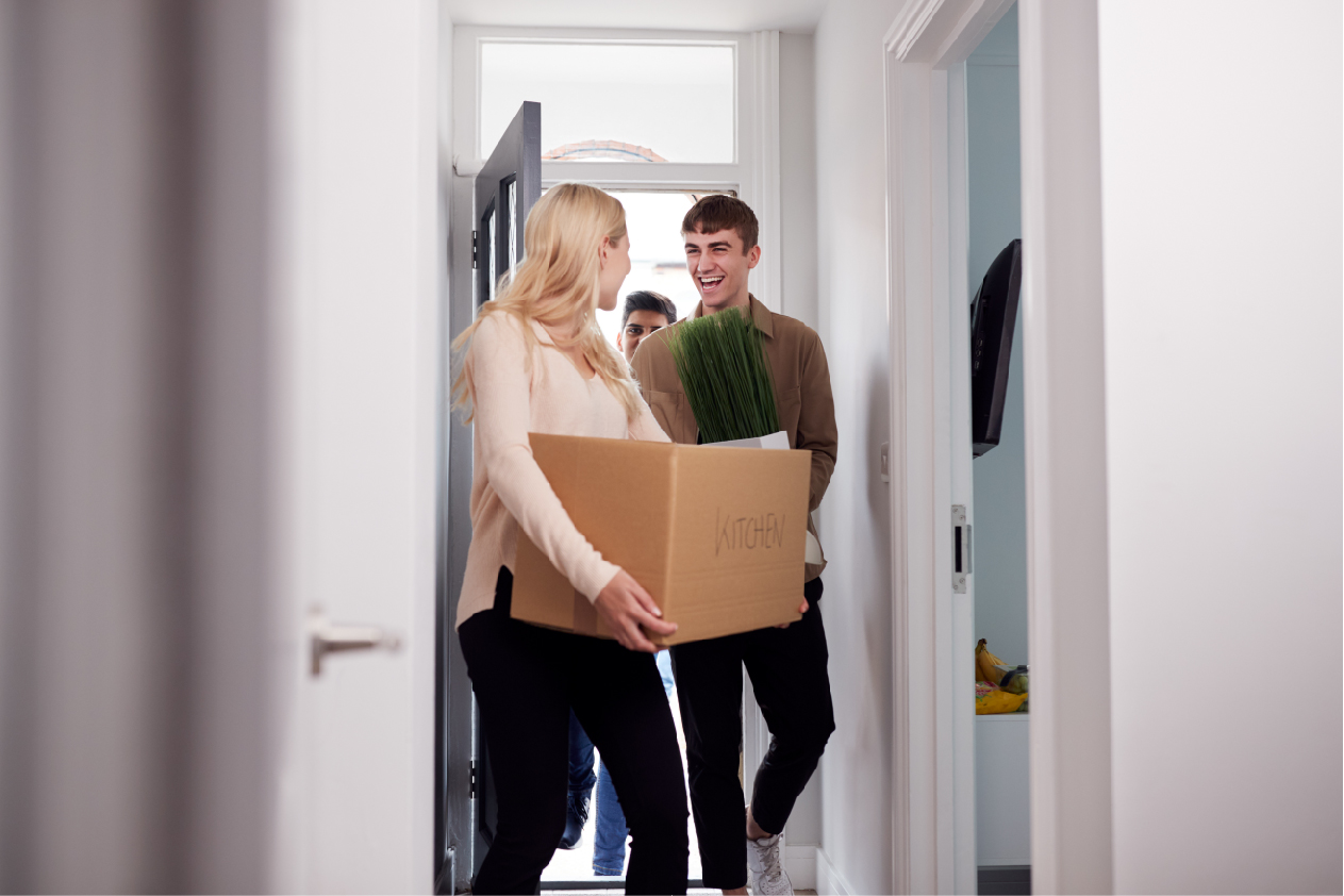 young adults moving into apartment
